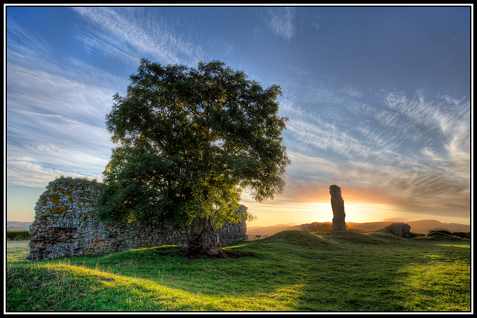 Cessford Castle, early morning sunshine.